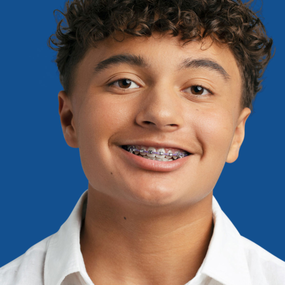 image of smiling young man with metal braces